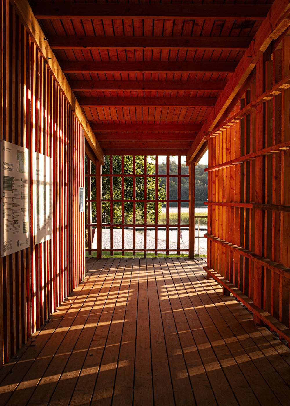 brown wooden hallway with white wooden doors