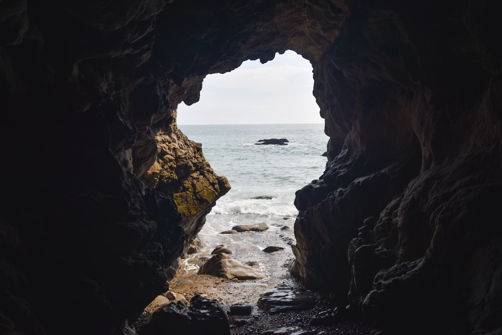 brown rock formation near sea during daytime