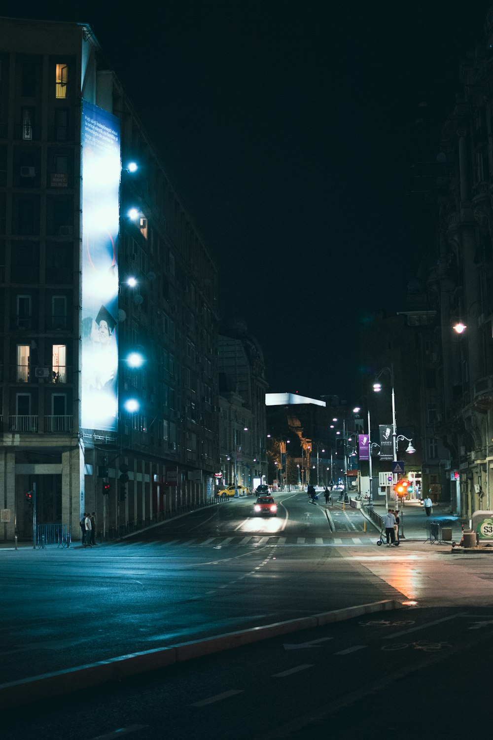 people walking on street during night time