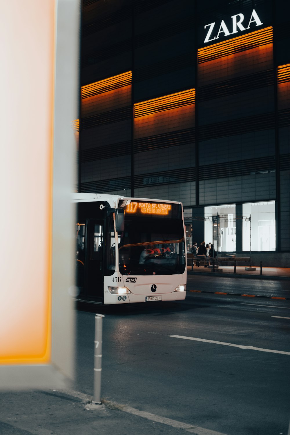 white bus on road during daytime