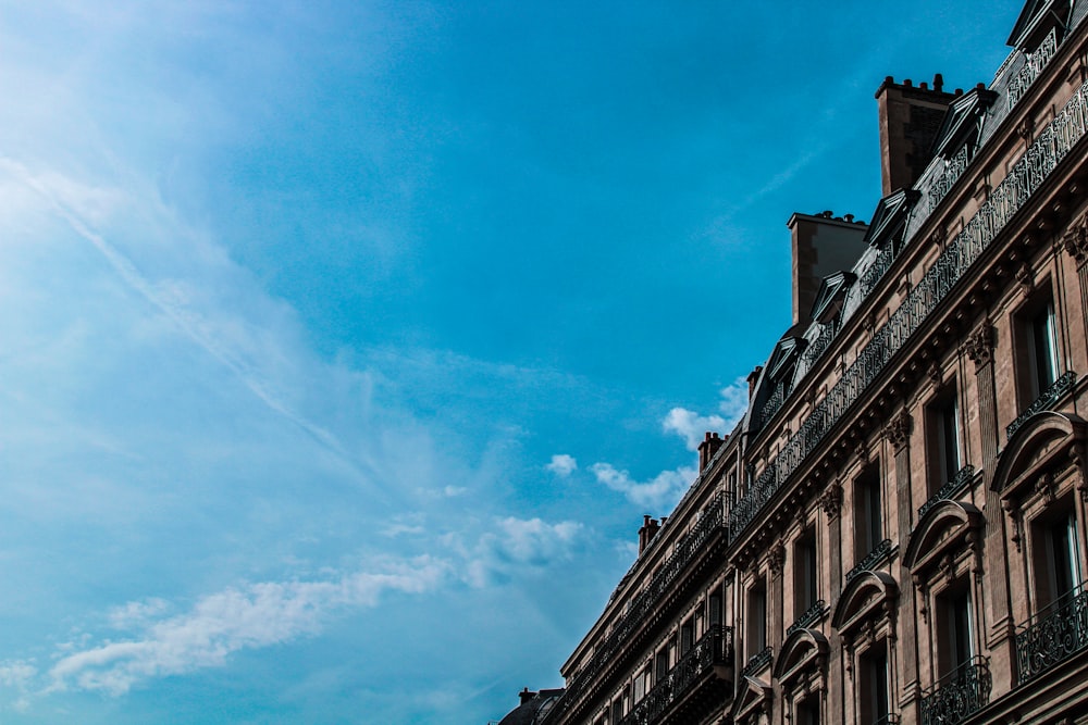 brown concrete building under blue sky during daytime