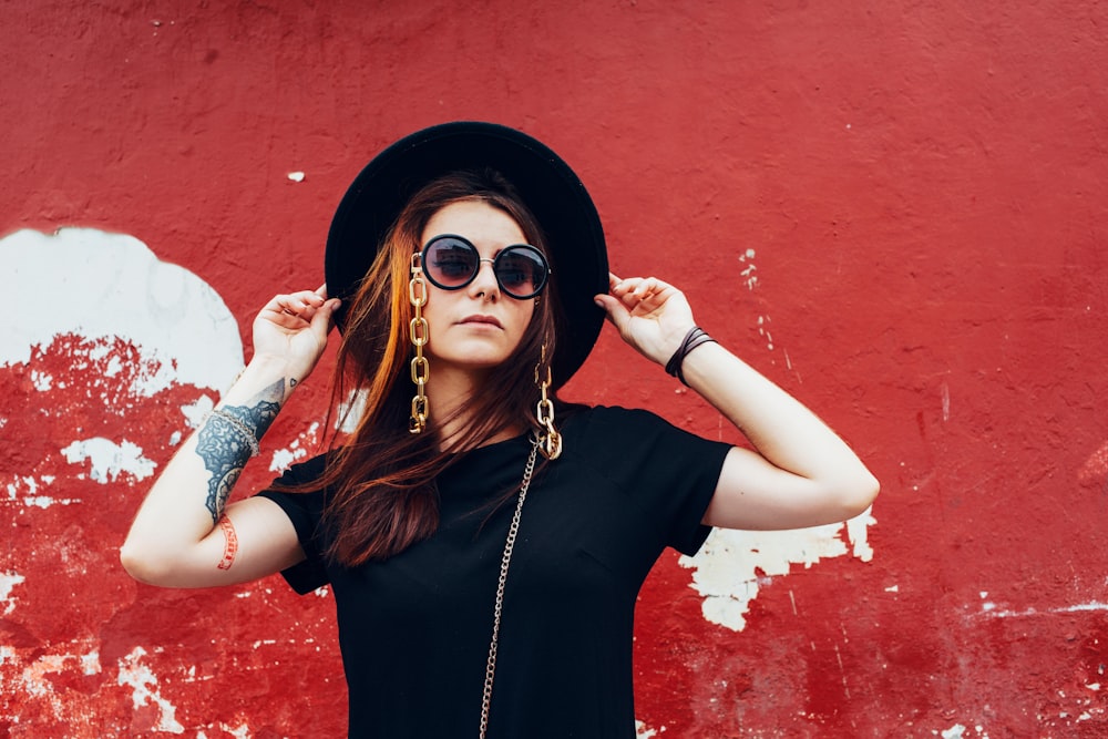 woman in black shirt wearing sunglasses