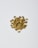 A pile of small, dried, tightly-coiled flower buds with a greenish-brown color scattered on a plain white background.