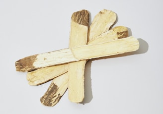 a cross made of wood on a white background