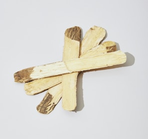 a cross made of wood on a white background