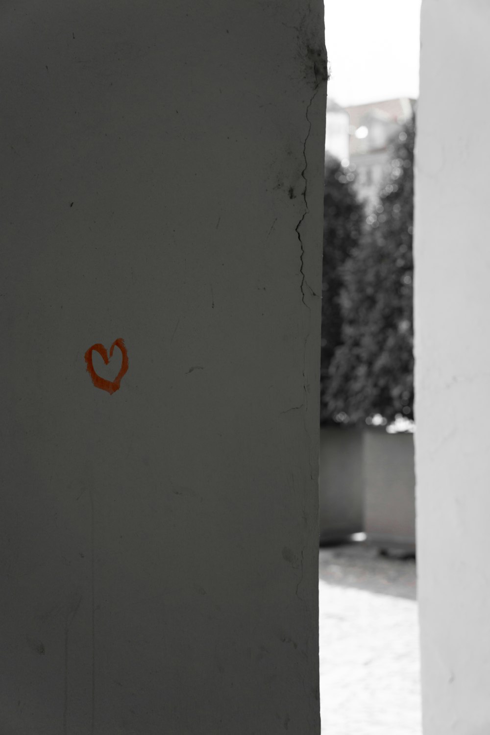 red heart on gray concrete wall