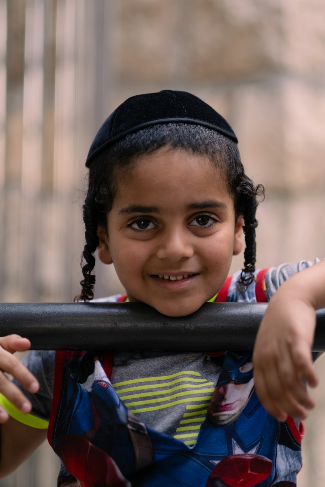 girl in red and white stripe shirt wearing black knit cap