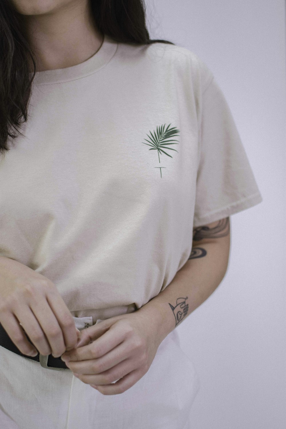 woman in white and green floral crew neck t-shirt