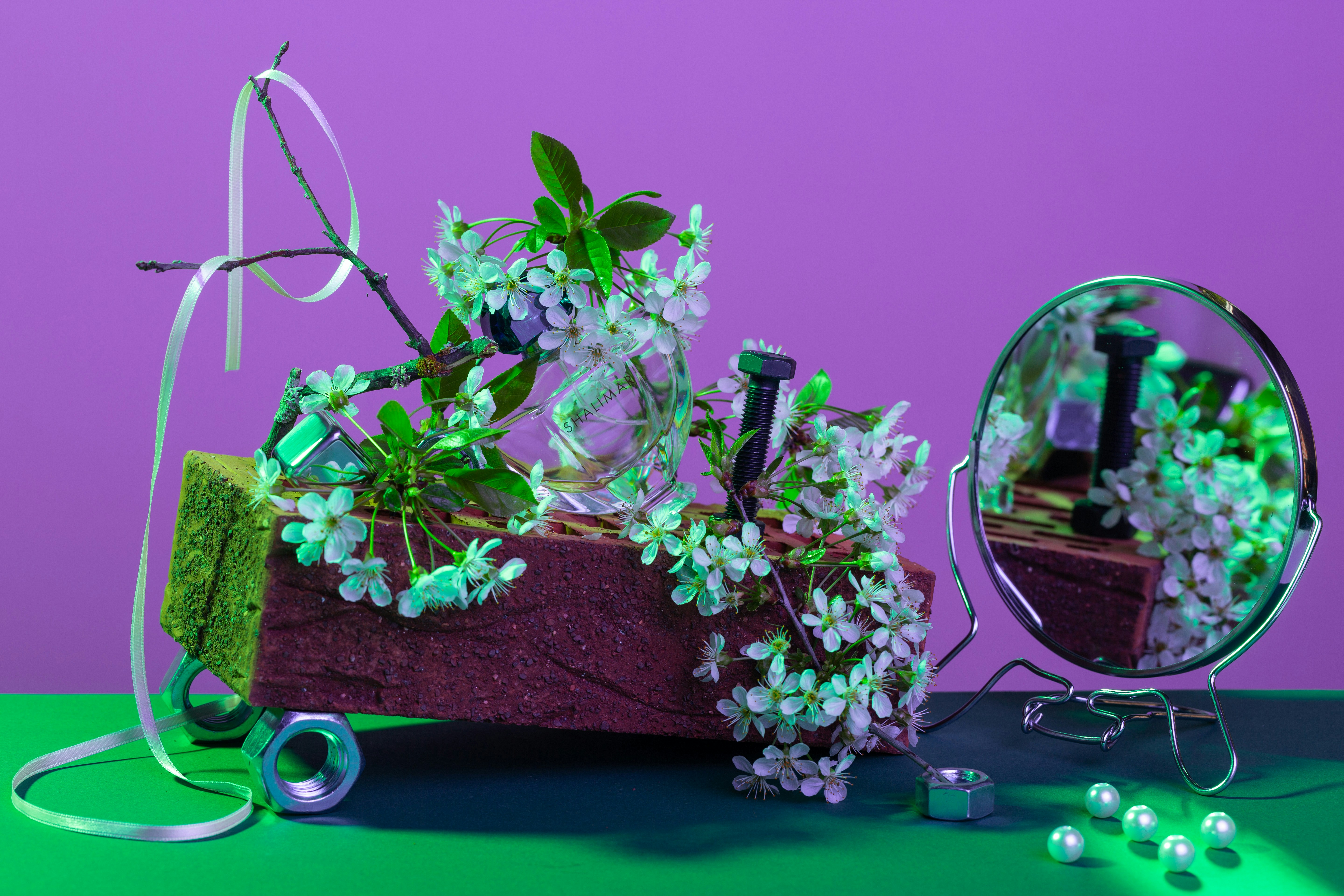 pink and white flowers on brown wooden table