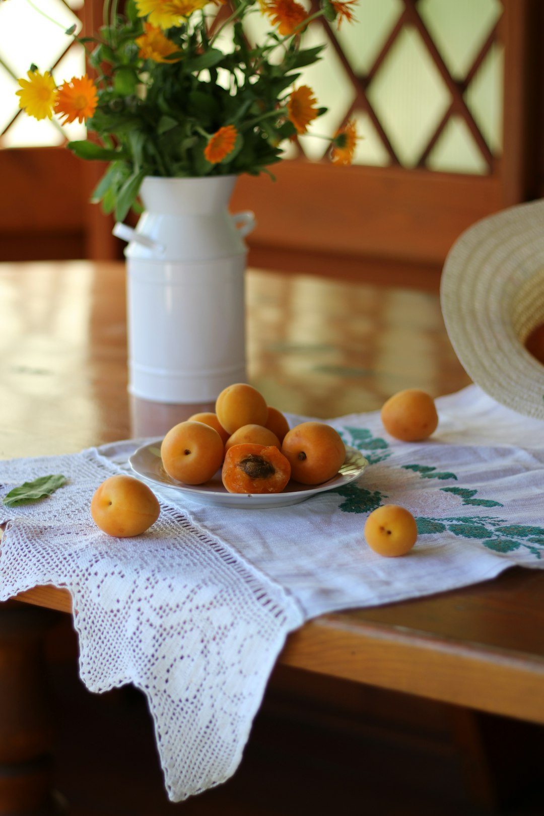 orange fruits on white table cloth