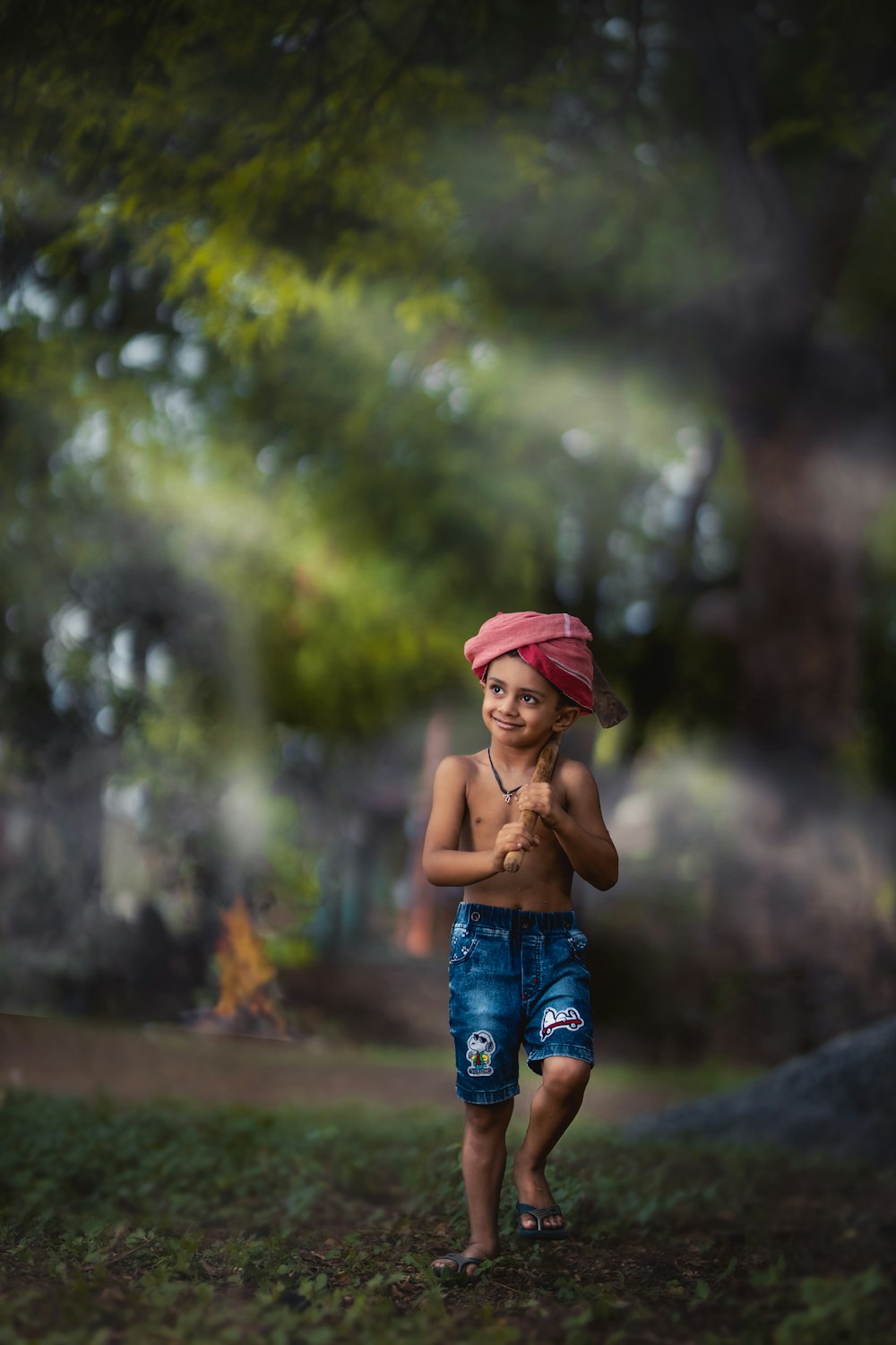 girl in pink hat and blue denim shorts