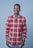 man in red and white plaid dress shirt