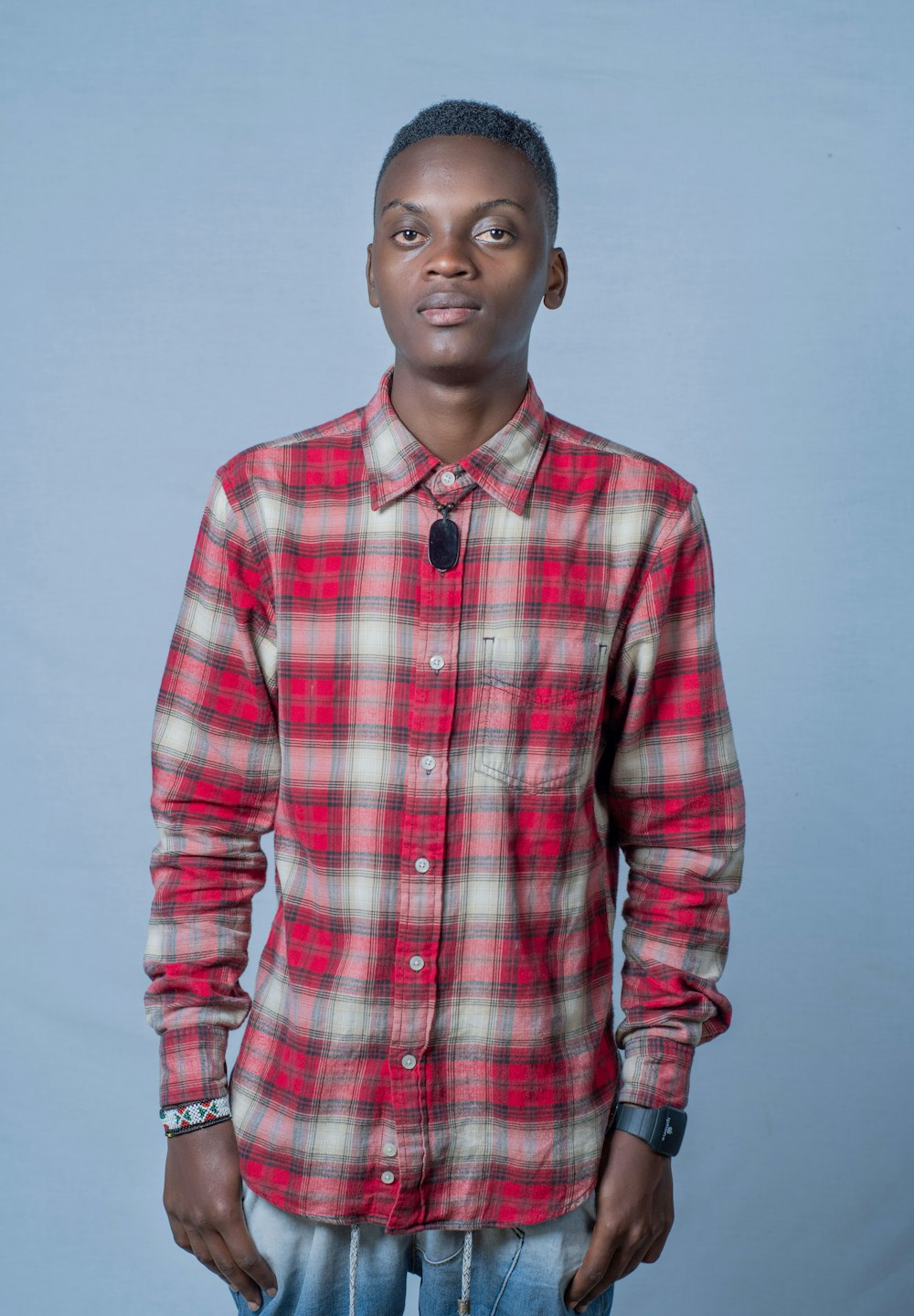 man in red and white plaid dress shirt