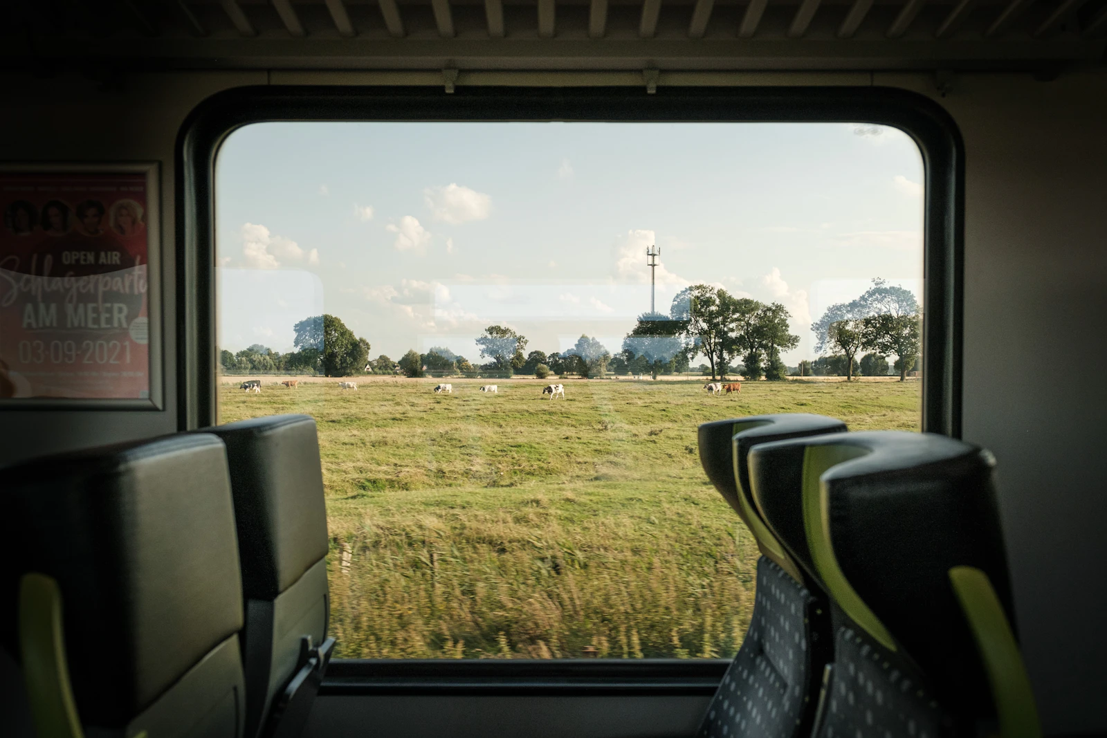 View from a train window at passing countryside in Europe