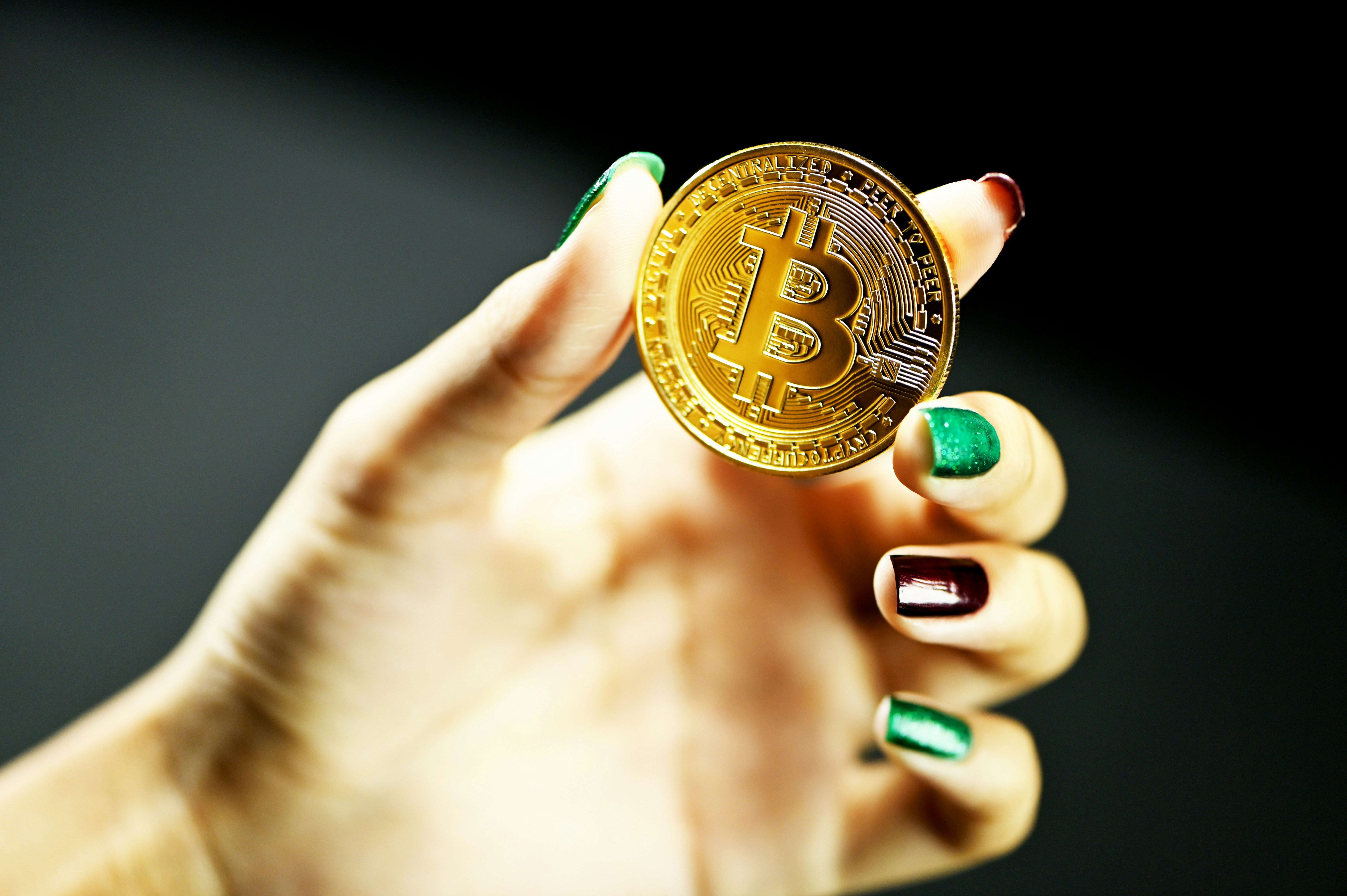 Showing Bitcoin in one hand