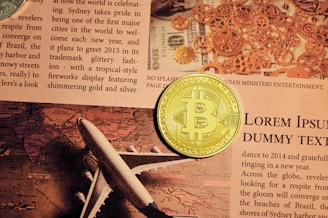 gold round coin on newspaper