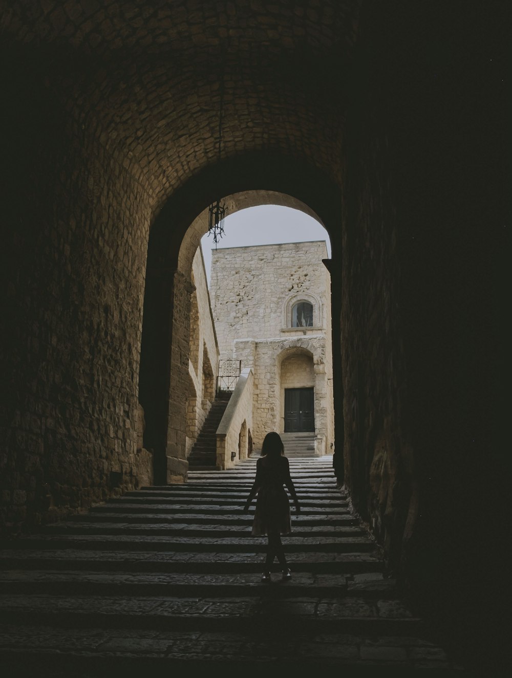 people walking on tunnel during daytime