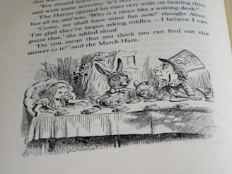 A black and white illustration of characters having a tea party. A young girl, a rabbit, a dormouse, and a man wearing a top hat sit around a table with teacups and a teapot. The background includes trees and foliage. The text above the illustration suggests a whimsical and literary context.