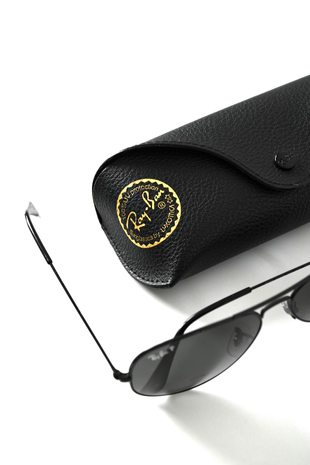 black sunglasses on black leather pouch