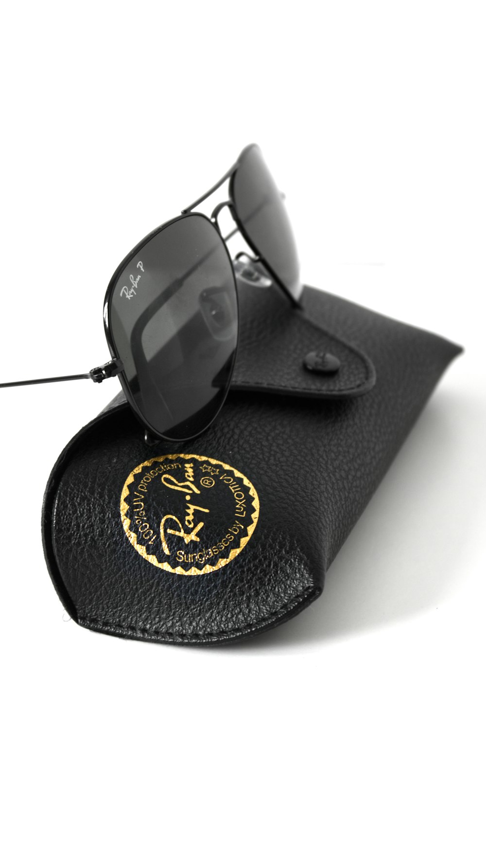 black sunglasses on black leather case