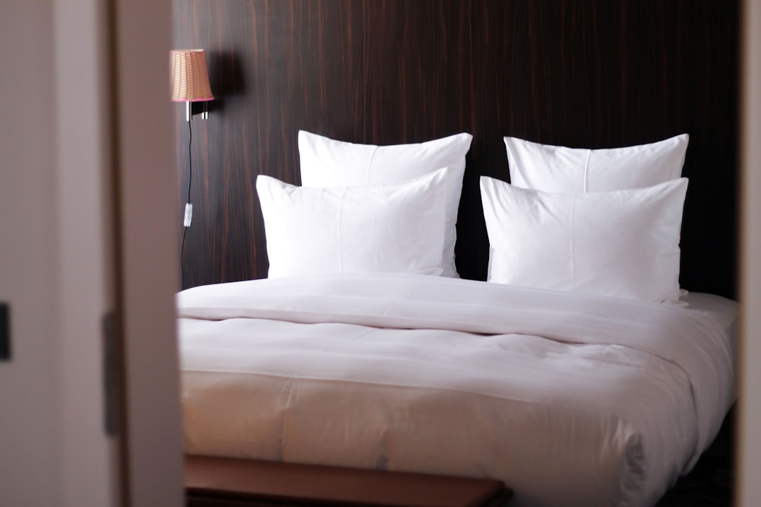 white bed pillow on white bed, Hotel experience