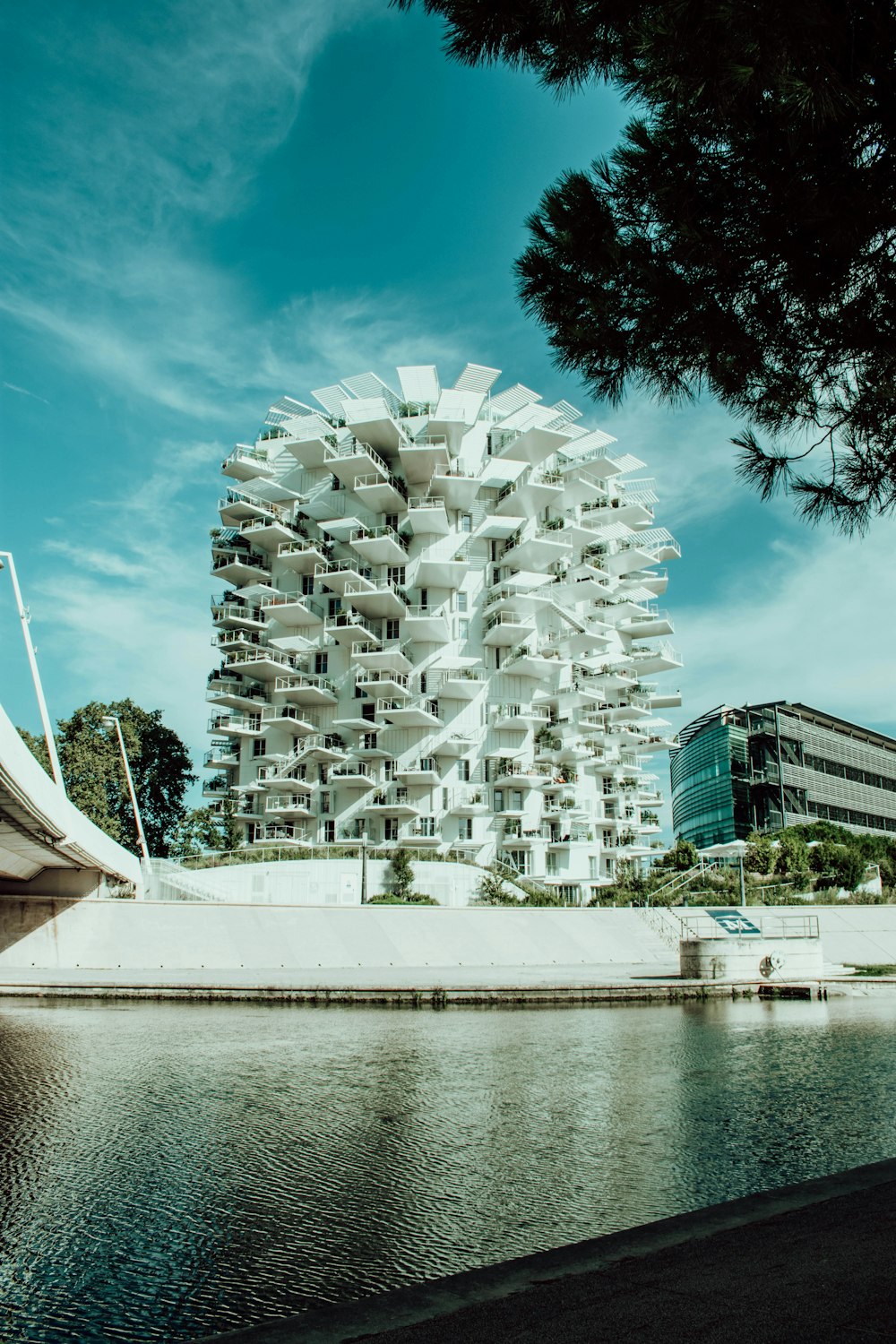 white concrete building near body of water during daytime