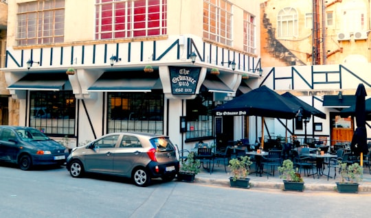 cars parked in front of store during daytime in Valletta Malta