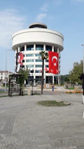 Exterior view of a contemporary office building located in a bustling Turkish city.
