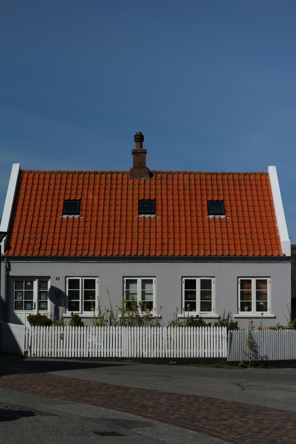 white and brown concrete house under blue sky during daytime