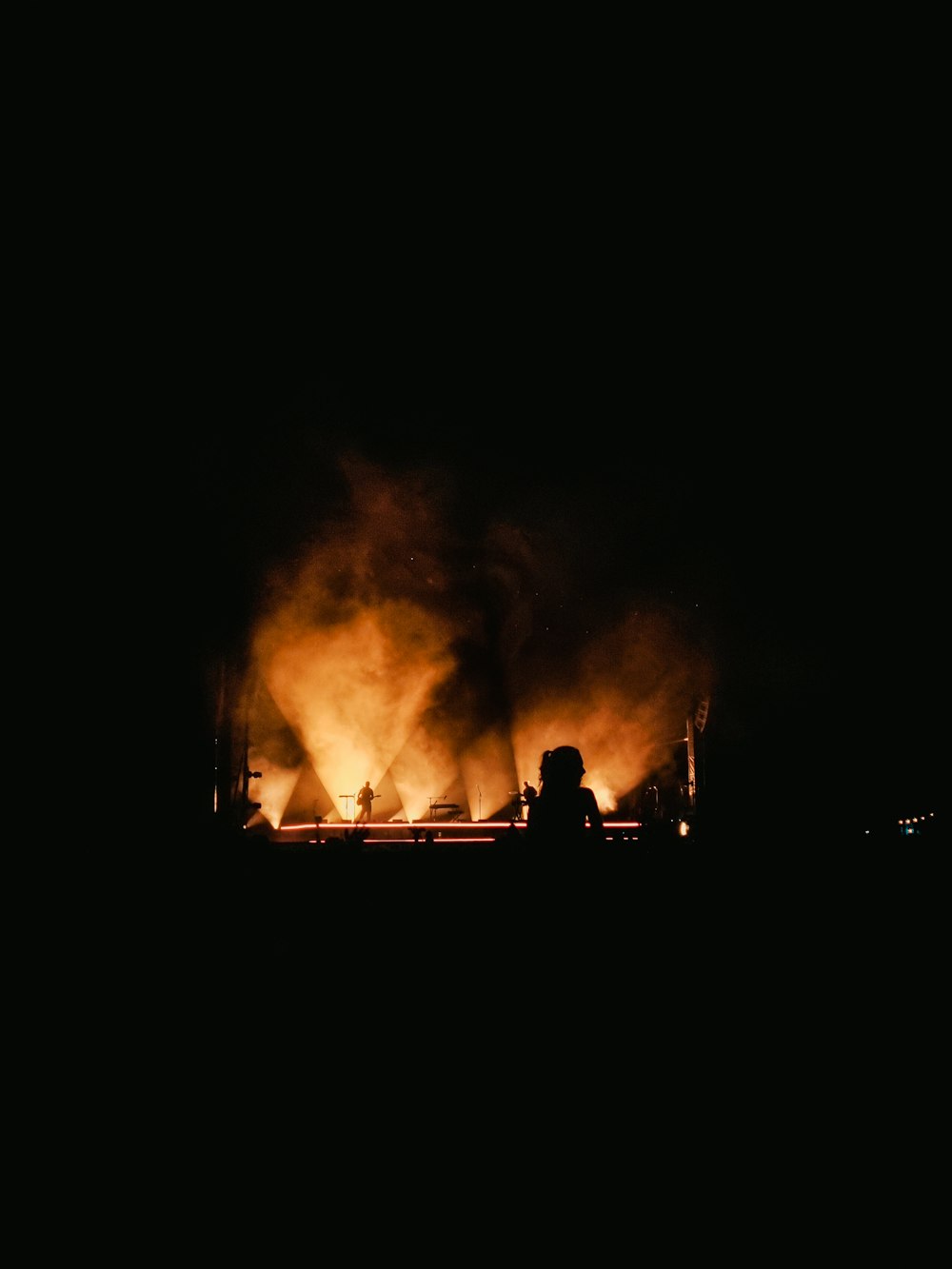 people standing on a fire place during night time