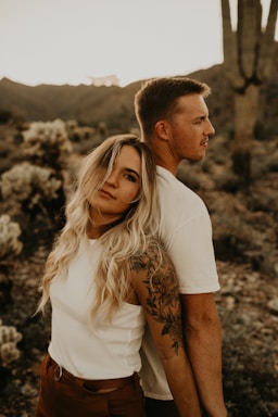 photography poses for couples,how to photograph man in white t-shirt beside woman in brown and white floral shirt