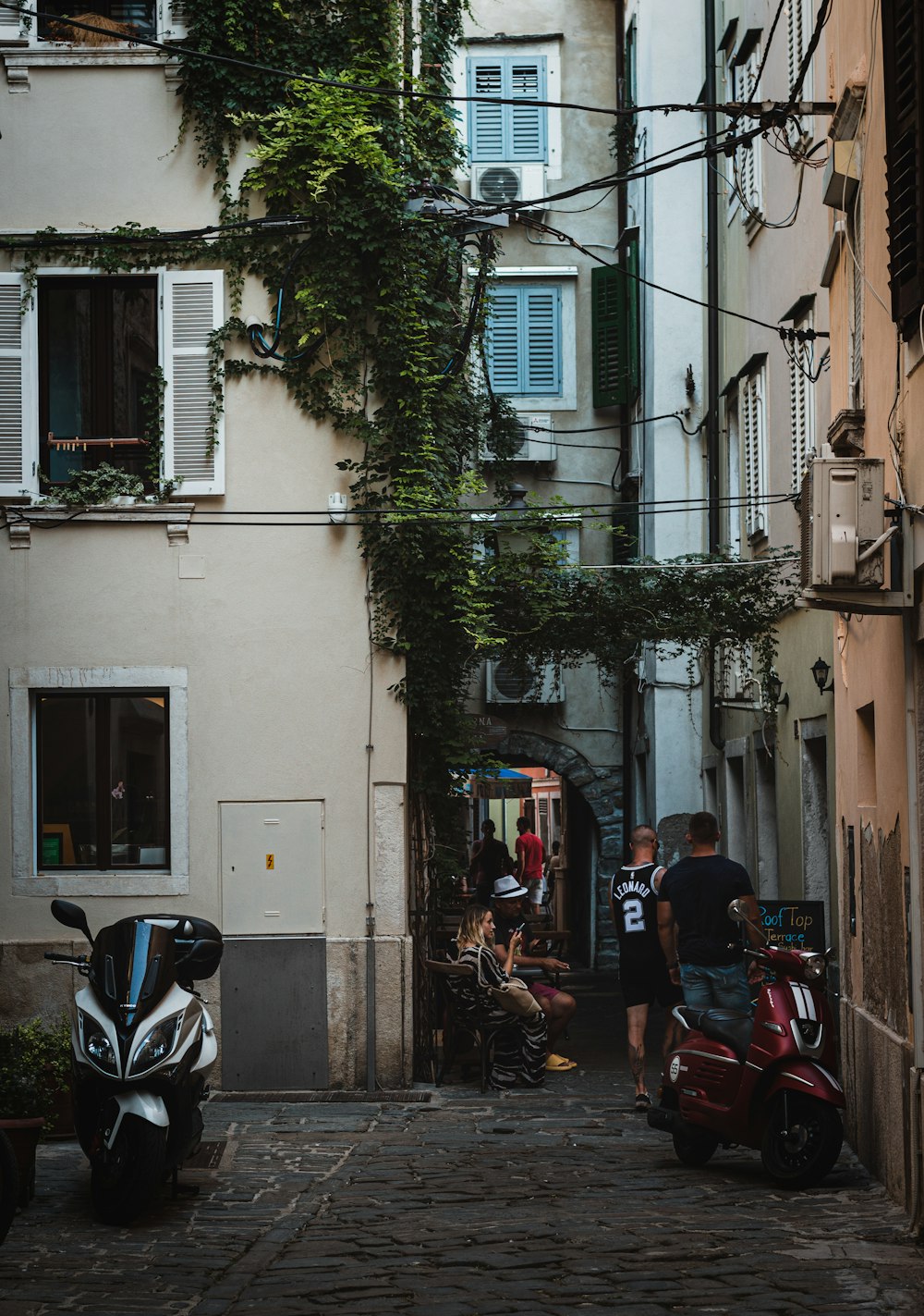 people riding motorcycle on road during daytime