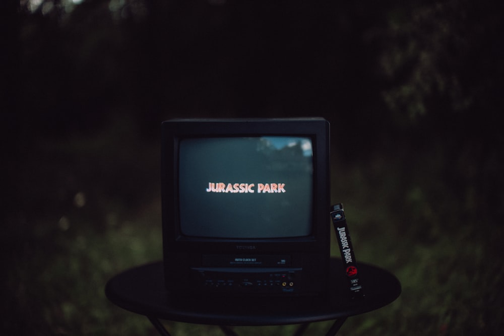 black crt tv on black table