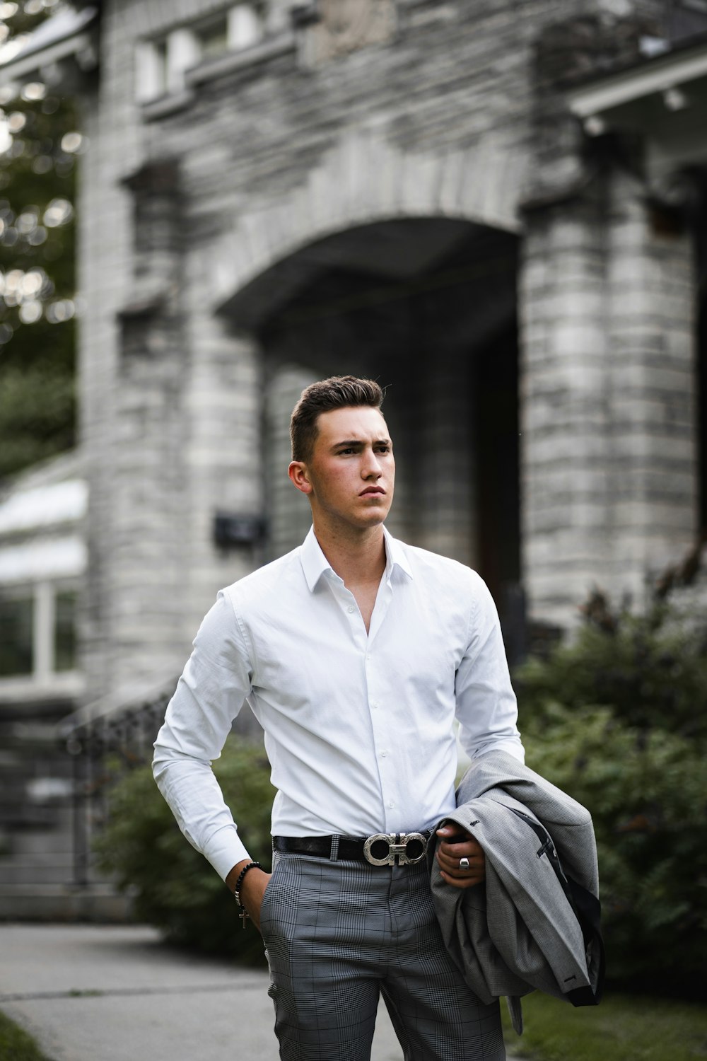 man in white dress shirt wearing black sunglasses