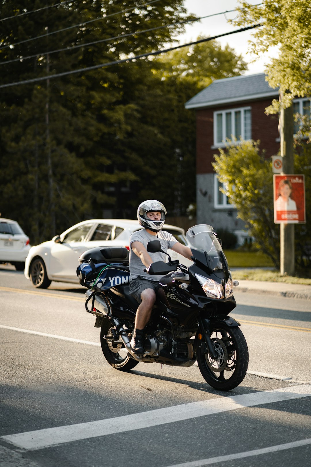 man in black helmet riding on black motorcycle during daytime