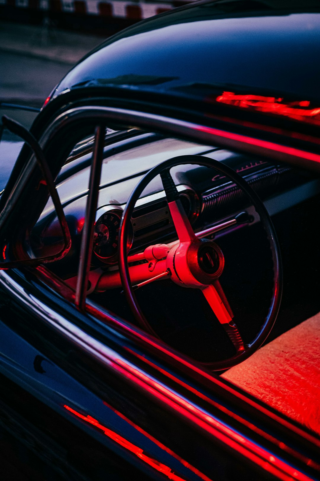red and black car steering wheel