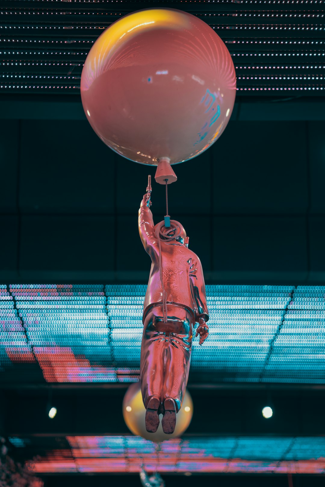 pink and blue balloons with string lights