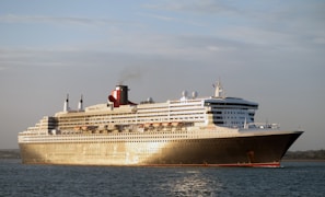 A serene cruise ship sailing on calm waters.