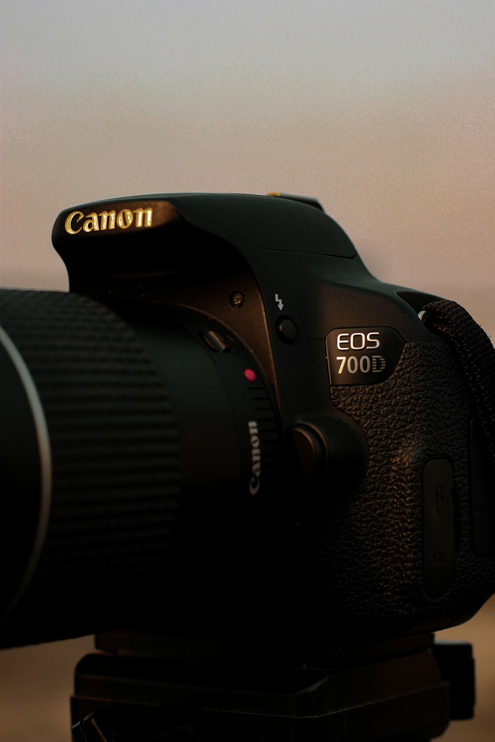 black nikon dslr camera on white table