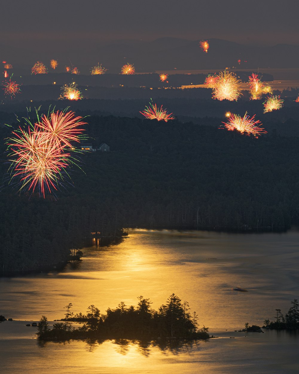 fireworks display over lake during night time