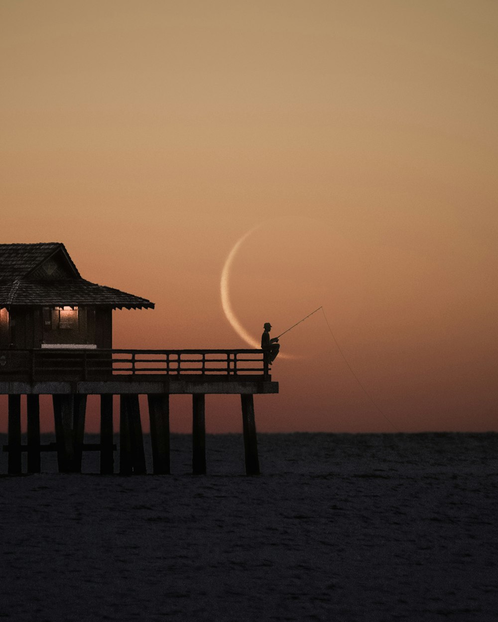 brown wooden dock on sea during daytime