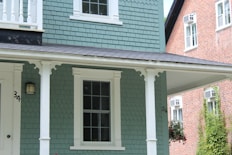 white and brown brick house