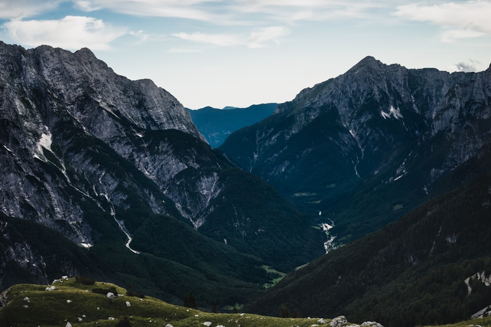 green and brown mountains under white clouds during daytime