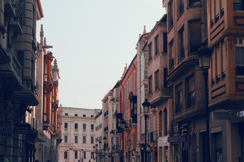 brown and white concrete buildings under white sky during daytime