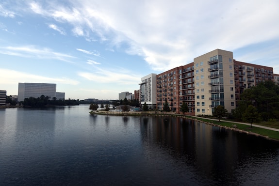 body of water near city buildings during daytime