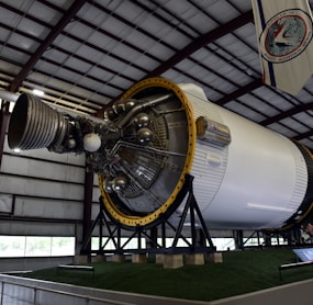 a large jet engine sitting inside of a hangar