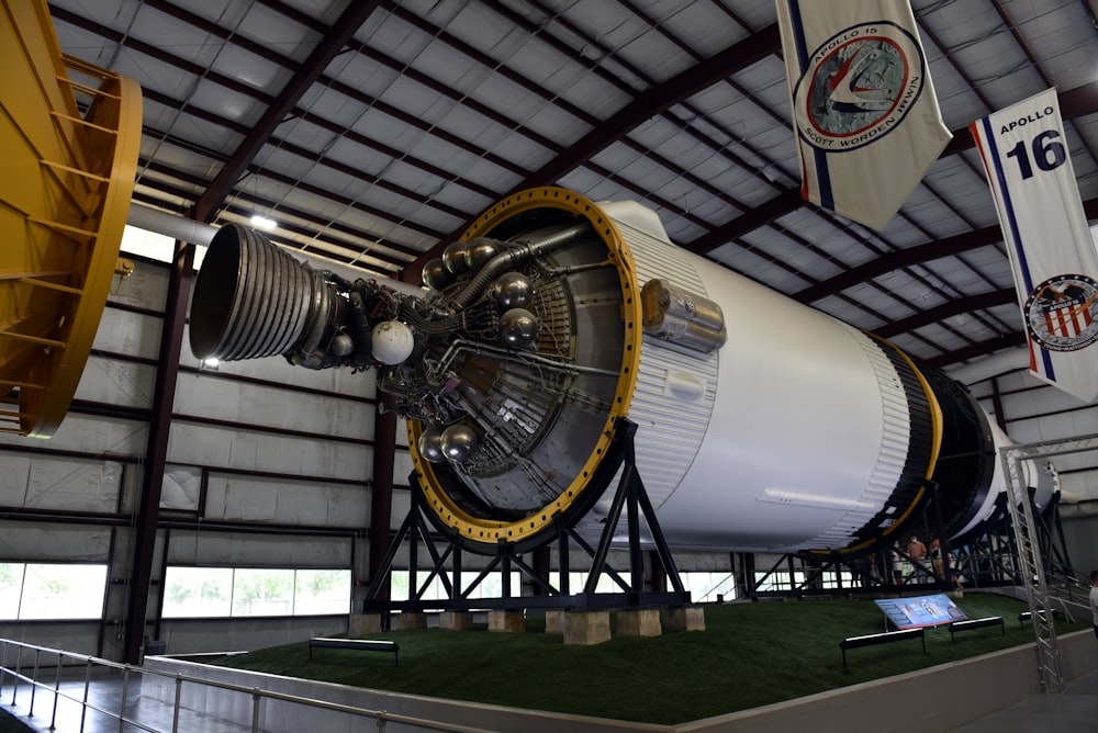 a large jet engine sitting inside of a hangar