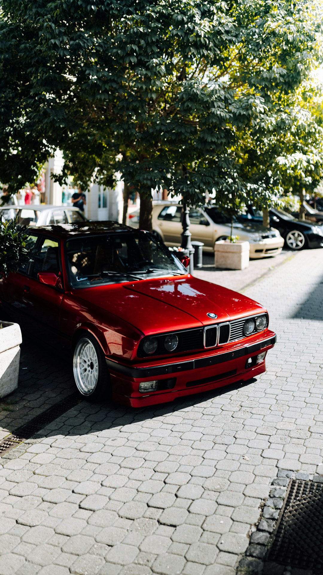 red car parked on parking lot during daytime