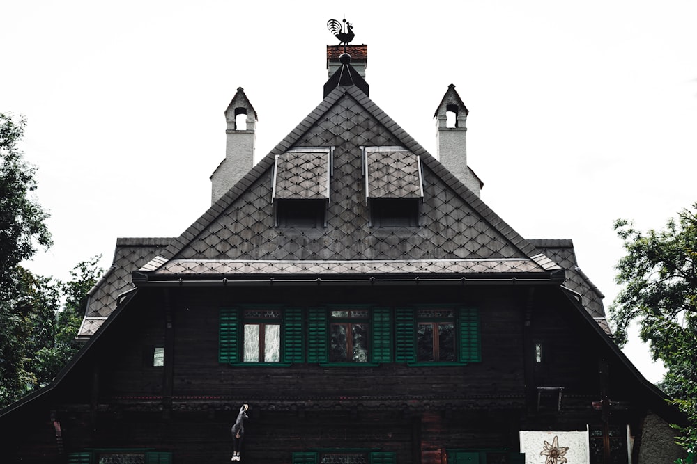 black and brown concrete house under white sky during daytime