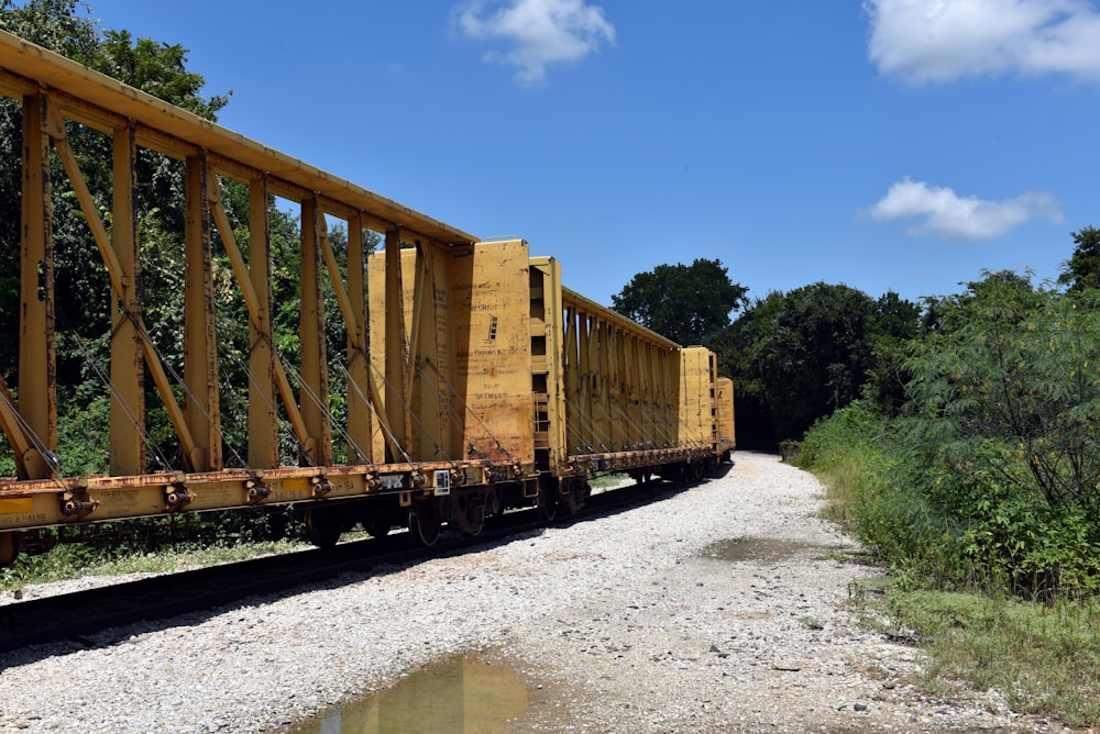 brown wooden train under blue sky during daytime